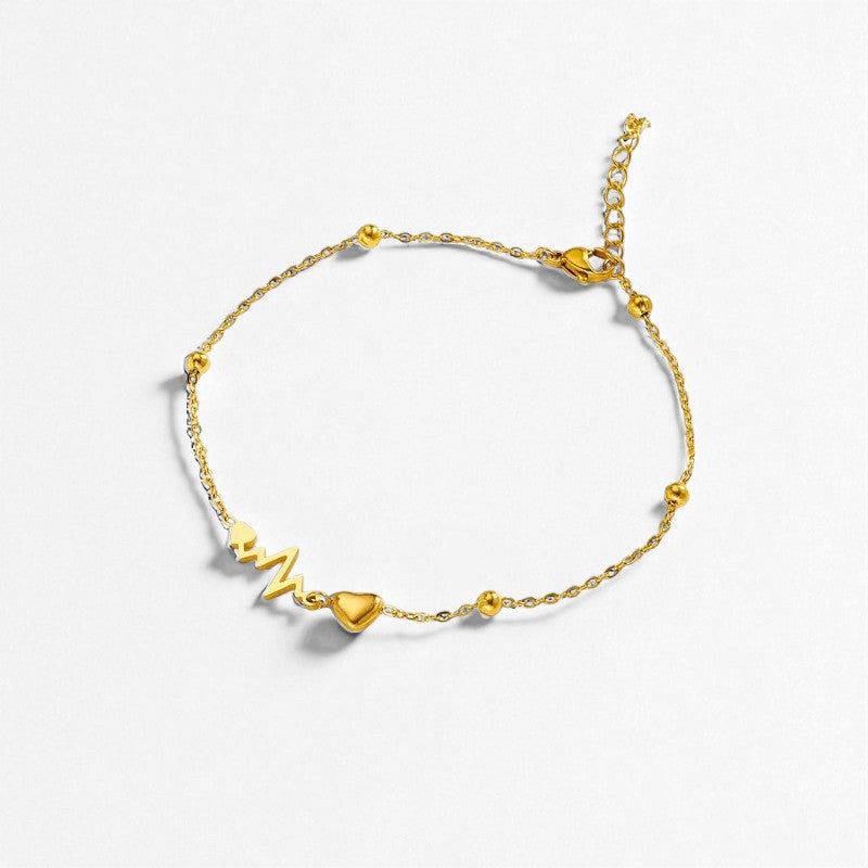bracelet de cheville dorée électrocardiogramme femme